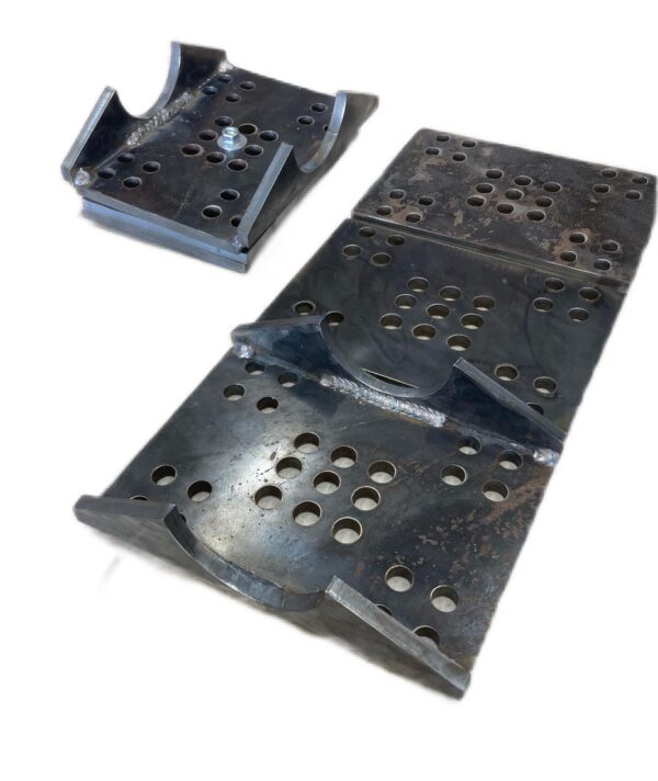 A pair of metal plates with holes in them, suitable for a Leaf Spring Conversion Kit.